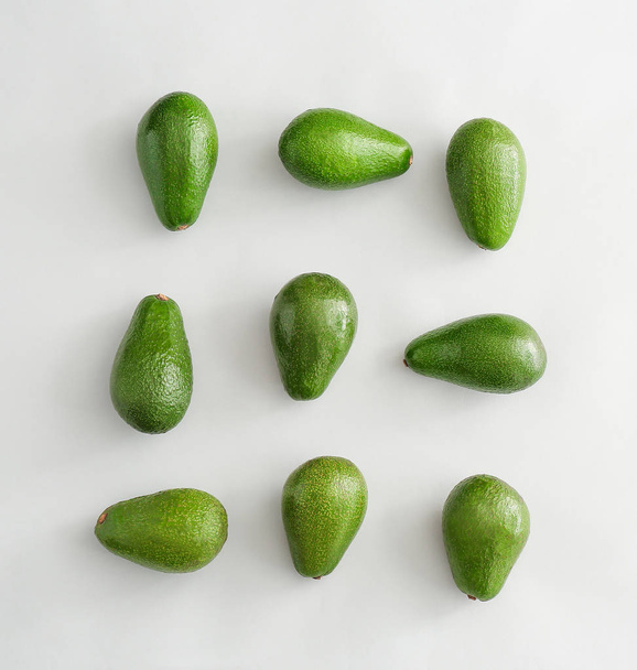 Fresh ripe avocados on white background - Φωτογραφία, εικόνα