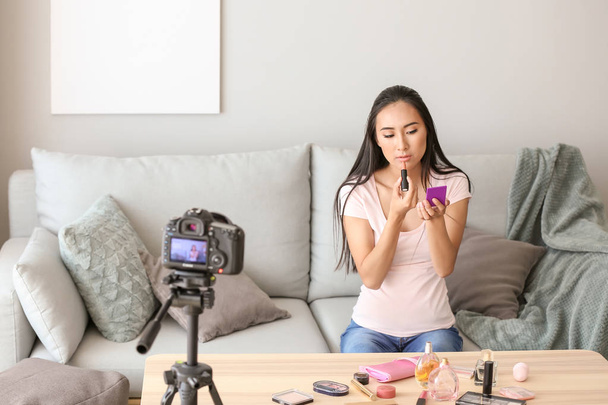 Asian beauty blogger recording video at home - Фото, изображение