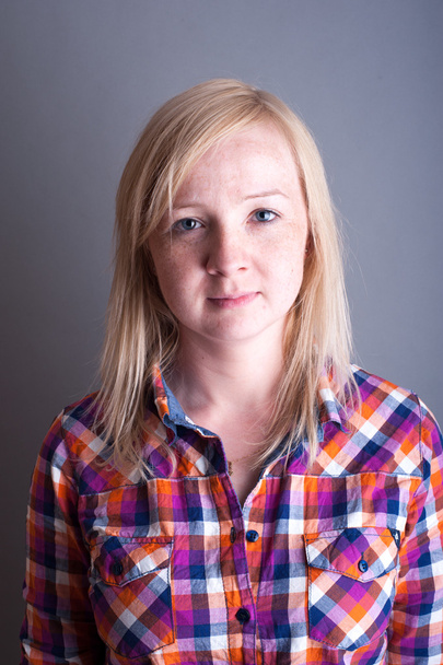 Studio portrait of freckled blonde - Photo, image