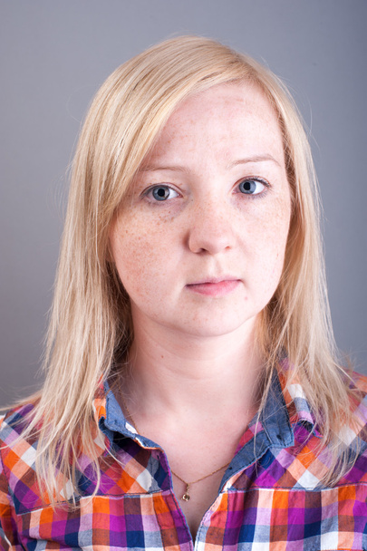 Studio portrait of freckled blonde - Photo, Image