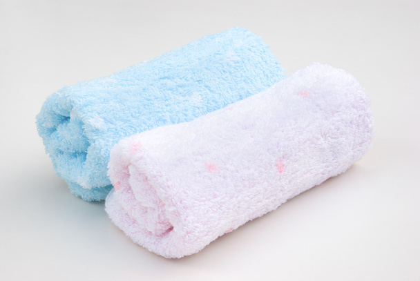 Rolos de toalha rosa e azul
 - Foto, Imagem