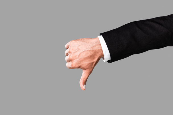 cropped view of businessman in black suit showing thumb down isolated on grey - Fotoğraf, Görsel