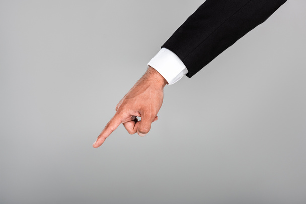 partial view of businessman pointing with finger isolated on grey - Фото, изображение