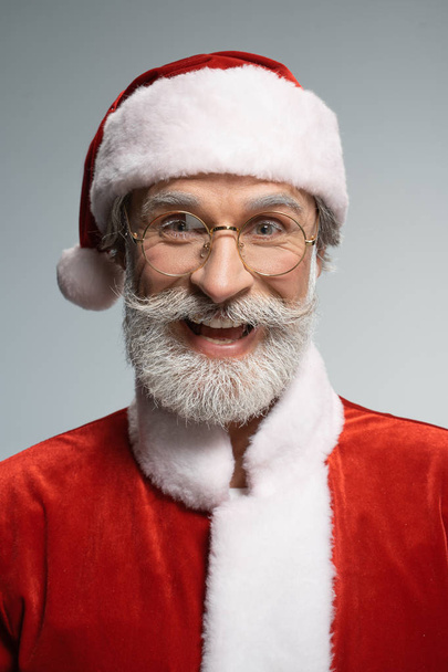 Elderly Santa Claus looking at camera with smile - Фото, изображение