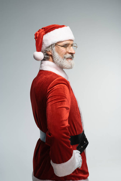 Santa Claus looking away with wide smile - 写真・画像