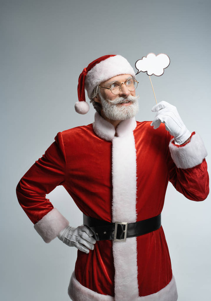 Santa Claus with thought bubble in hand - Foto, Bild