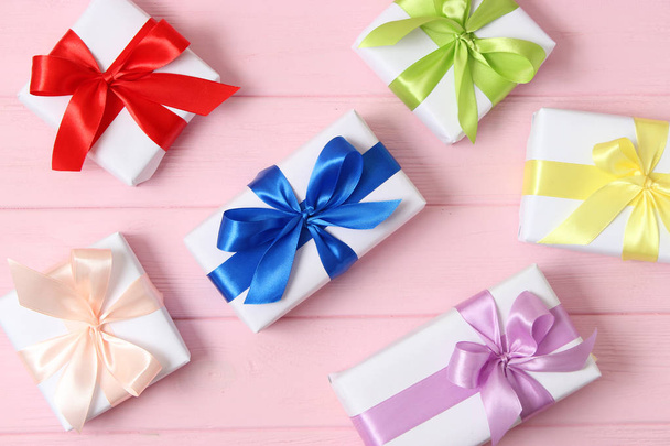 gifts on a colored background top view. Holiday, giving presents, birthday. - Photo, Image