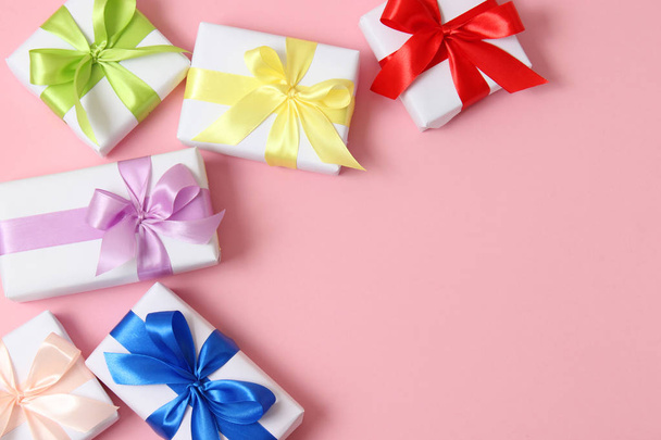 gifts on a colored background top view. Holiday, giving presents, birthday. - Photo, Image
