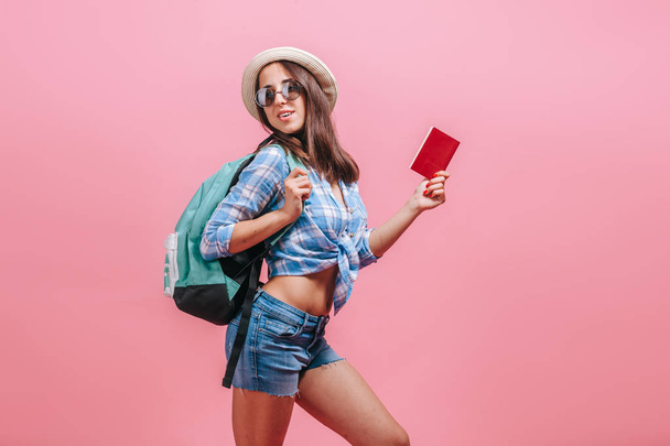 Tourist girl on pink background - Фото, изображение