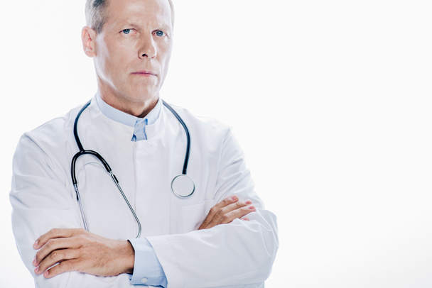 handsome doctor in white coat with crossed arms isolated on white - Φωτογραφία, εικόνα