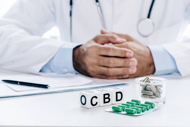 selective focus of cubes with lettering cbd and pills  - Photo, image