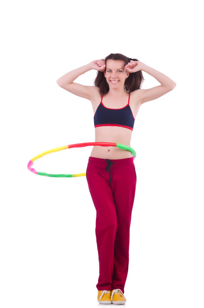 Woman doing exercises with hula hoop - 写真・画像