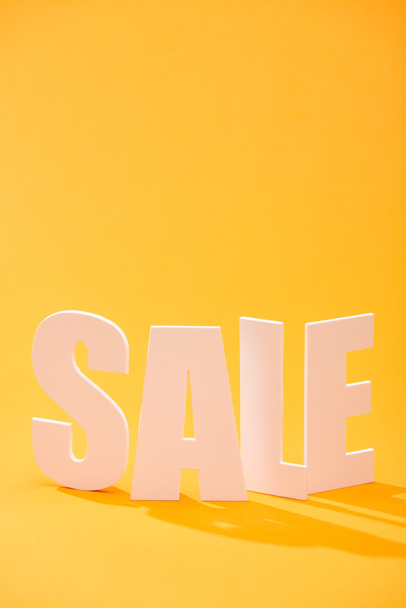 white sale lettering on bright orange background - Photo, Image