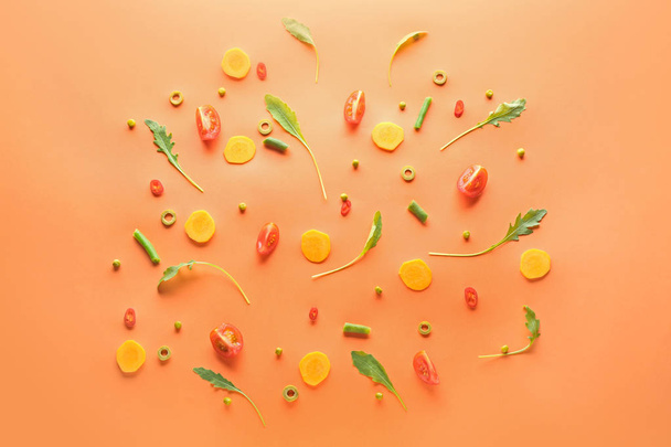 Fresh arugula and vegetables on color background - Fotografie, Obrázek