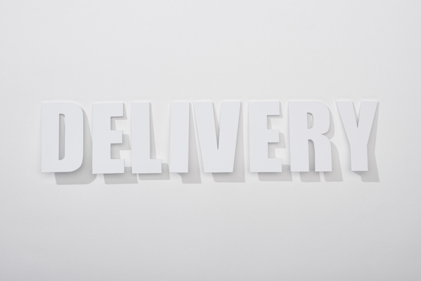 delivery text with shadow on white background with copy space - Fotoğraf, Görsel