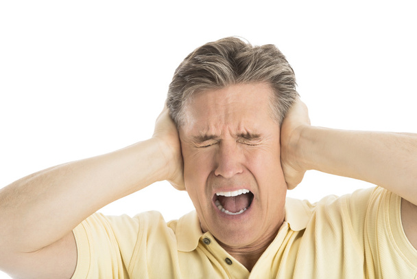 Furious Man Screaming While Covering His Ears - Фото, зображення