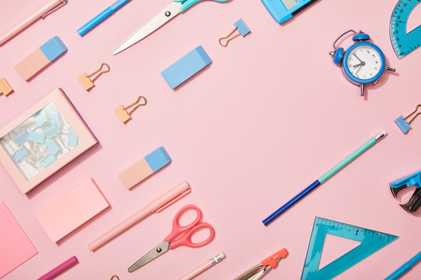 flat lay with blue school supplies and copy space isolated on pink - Foto, immagini