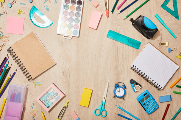 top view of various school supplies on wooden desk - Photo, Image