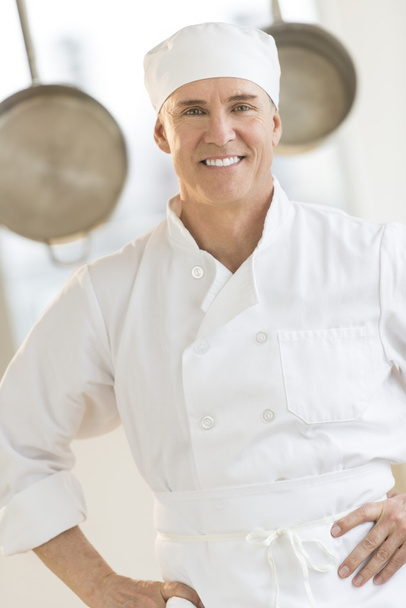 Confident Chef Standing In Commercial Kitchen - Foto, imagen