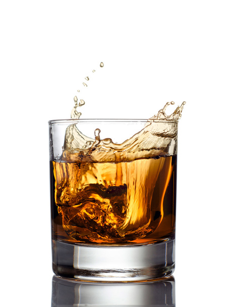 Whisky splash isolated on a white background - Foto, afbeelding