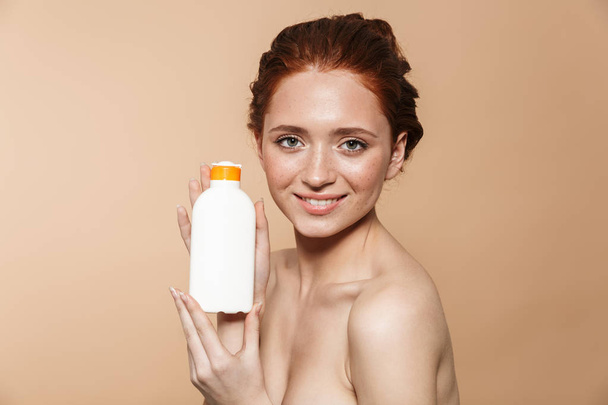 Beauty portrait of an attractive young topless redhead woman - Фото, изображение