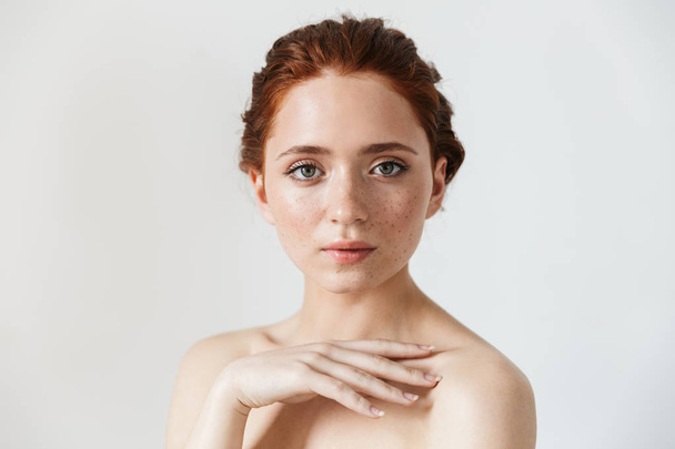 Young redhead woman posing isolated over white wall background. - Фото, зображення