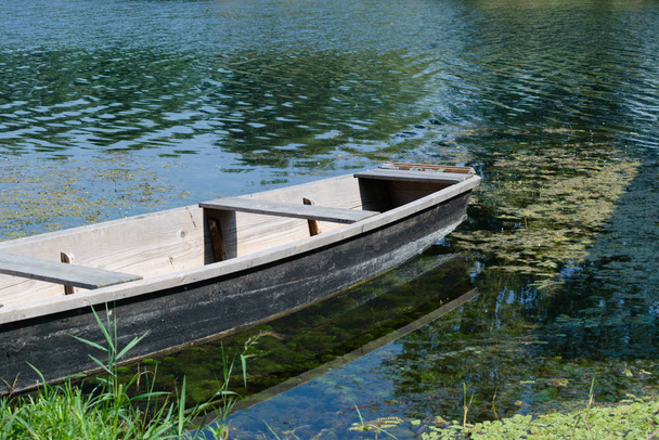 Old wooden boat on the river - Photo, Image