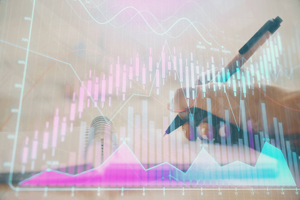 Forex graph on hand taking notes background. Concept of research. Multi exposure - 写真・画像