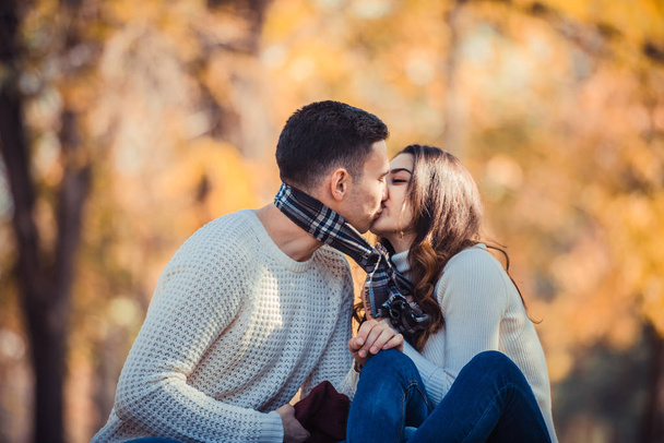 Attractive couple is spending the day in nature and they are kissing - Foto, Imagen