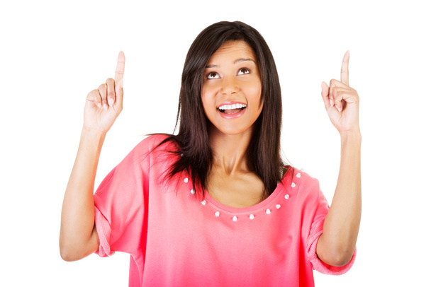 Happy , excited young woman pointing on copy space - Photo, image