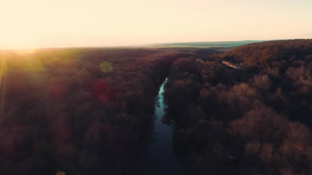 Aerial drone sunset view over river and mountain forest. Amazon jungle. - Video