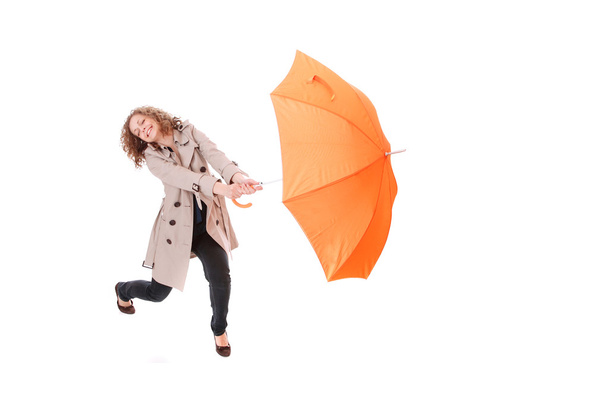 Woman holding an umbrella - Fotoğraf, Görsel