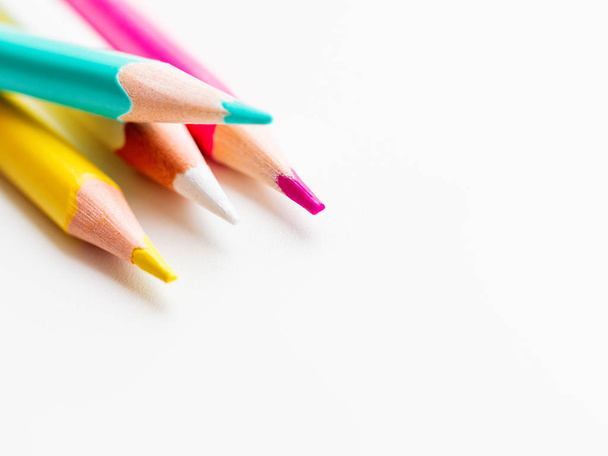 Colorful watercolor pencils on white background. School supplies with copy space. Kid's stationery. Back to school backdrop. - Fotoğraf, Görsel