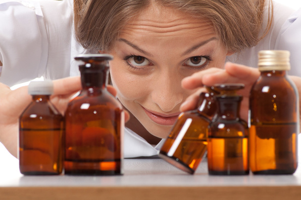 Woman doctor with medication in glass bottles - Foto, imagen