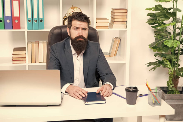 Office routine. Businessman in charge of business solutions. Developing business strategy. Risky business. Man bearded hipster boss sit office with laptop. Manager solving business problems - Foto, Imagem