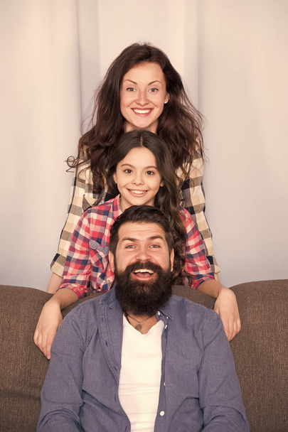Mom dad and daughter relaxing on couch. Happy parenthood. Close and trustful relations. Family values concept. Family bonds. Family spend weekend together. Friendly family having fun together - Zdjęcie, obraz