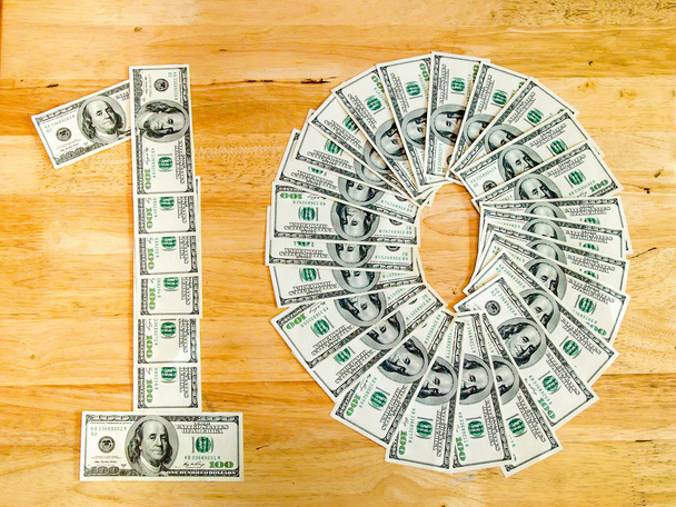 Sign10 dollar by 100 dollar bills - Foto, Imagem