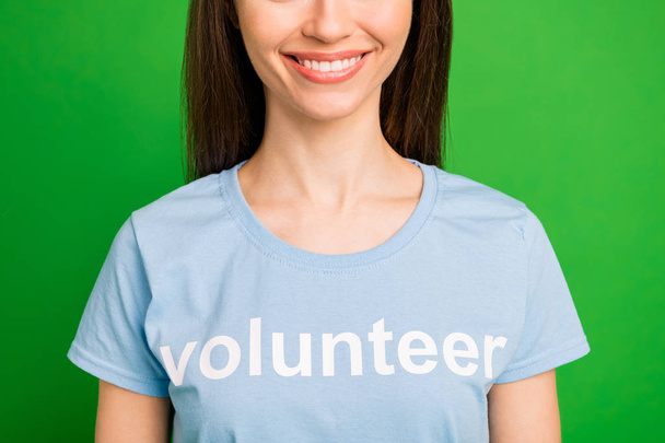 Cropped close-up portrait of her she nice attractive lovely cheerful cheery straight-haired girl wearing printed cotton corporate tshirt isolated over bright vivid shine green lime background - Fotografie, Obrázek