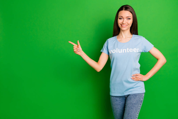 Portrait of her she nice attractive cheerful cheery confident straight-haired girl wearing printed tshirt ad advert copy space promotion isolated over bright vivid shine green lime background - 写真・画像