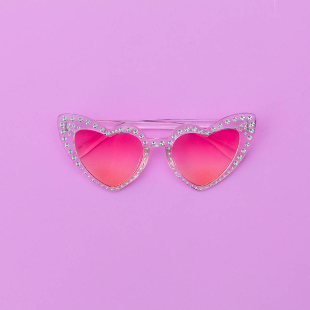 Trendy retro sunglasses hearts. Stylish accessory. Flat lay - Foto, imagen