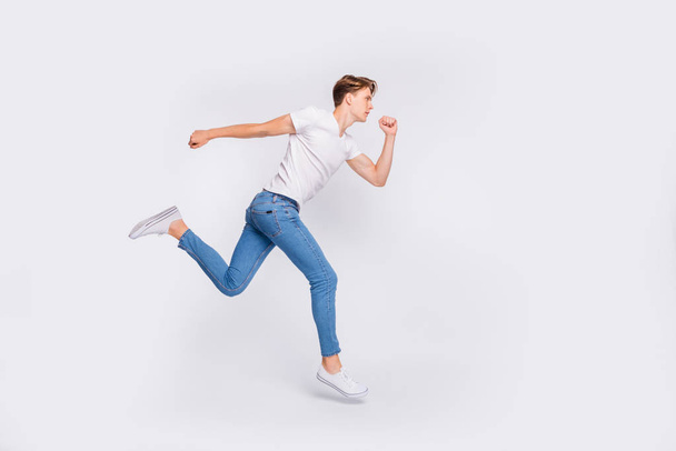 Full length photo of jumping high guy ready steady go concept wear casual outfit isolated white background - Fotó, kép