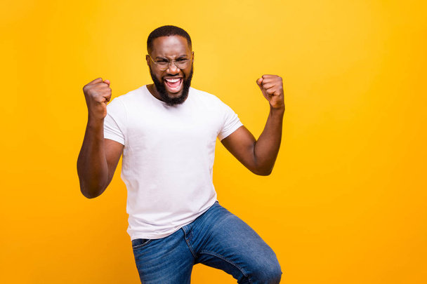 Photo of dark skin guy celebrating lottery winning wear casual outfit isolated yellow background - Foto, Imagem