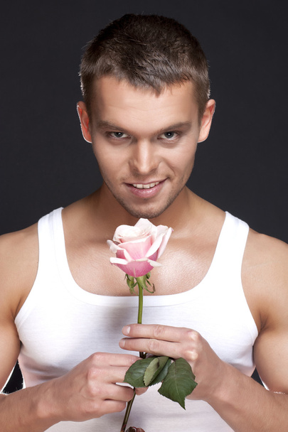Men with the pink rose - Valokuva, kuva