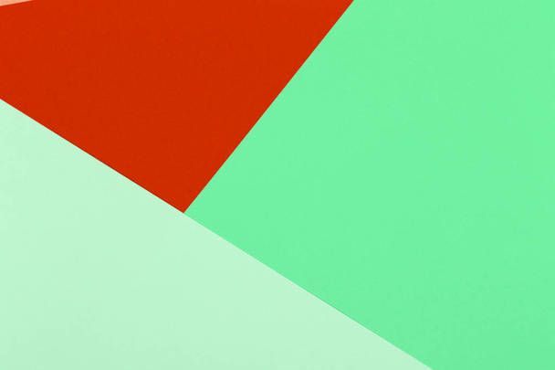 Paper red, orange, green, pastel empty background, geometrically located. Color blank for presentations, copy space. - Фото, зображення