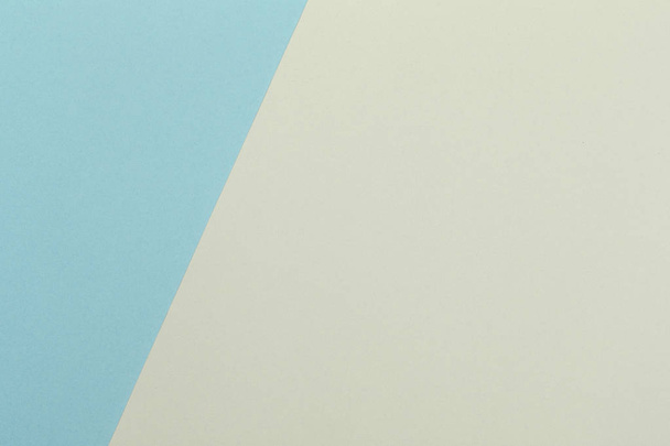 Paper yellow, blue empty background, geometrically located. Color blank for presentations, copy space. - Foto, afbeelding
