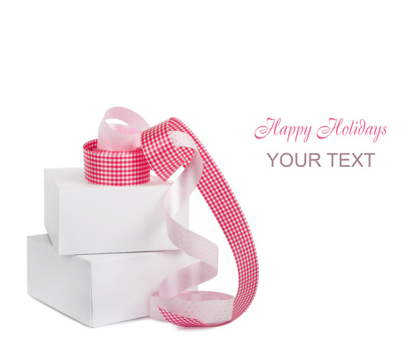 Gift boxes with pink ribbons isolated on a white background - Photo, Image