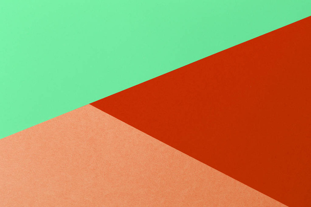 Paper red, orange, green, pastel empty background, geometrically located. Color blank for presentations, copy space. - Zdjęcie, obraz