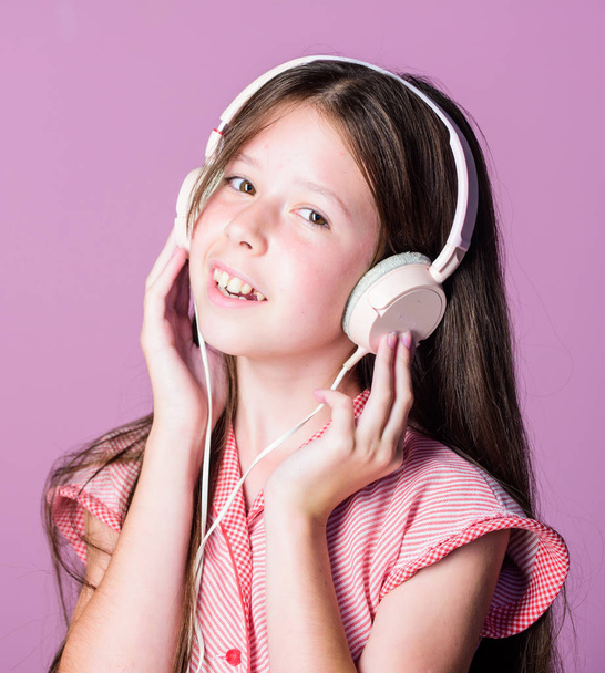 Audio book. Educative content. Study english language with audio lessons. Girl listen music modern headphones gadget. Perfect sound. Having fun. Listen for free. Enjoy music concept. Music app - 写真・画像