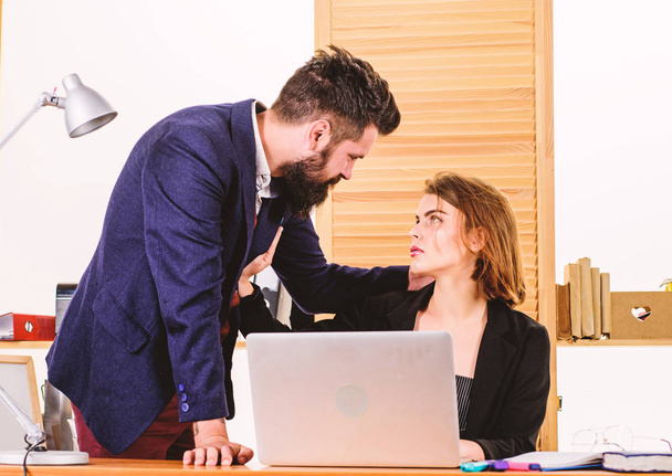 Flirting with coworker. Woman flirting with guy coworker. Woman attractive lady with man colleague. Office collective concept. Flirting at workplace entirely unprofessional. Flirting and seduction - 写真・画像