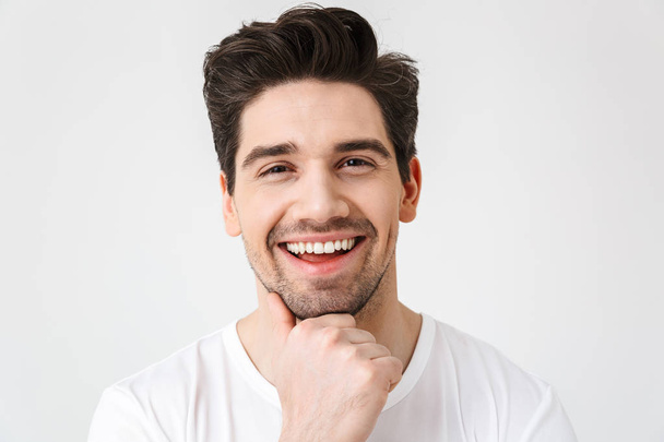 Happy young excited emotional man posing isolated over white wall background. - Photo, Image